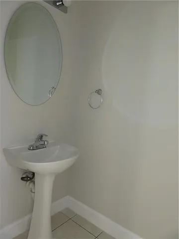 a bathroom with a sink and mirror