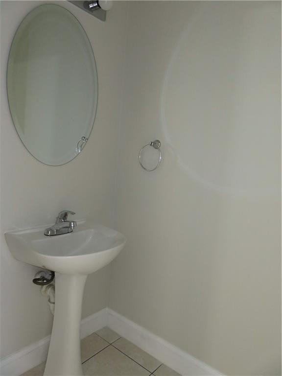 9764 Kamena Circle Boynton Beach, FL 33436 - Photo 6 of 18 a bathroom with a sink and mirror