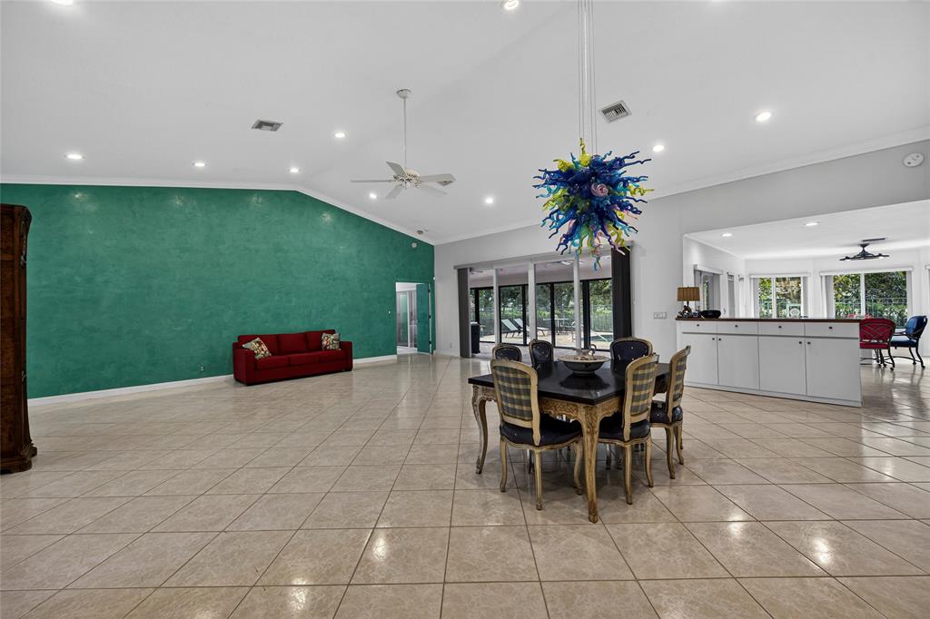 10405 Canoe Brook Circle Boca Raton, FL 33498 - Photo 13 of 56 a dining room with furniture and a potted plant