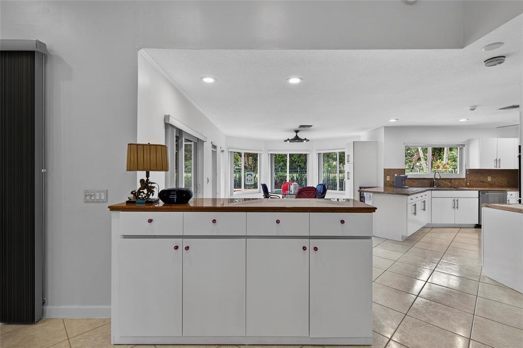 10405 Canoe Brook Circle Boca Raton, FL 33498 - Photo 15 of 56 a kitchen with cabinets and sink