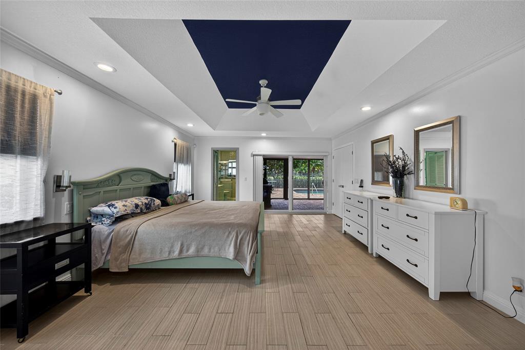 10405 Canoe Brook Circle Boca Raton, FL 33498 - Photo 28 of 56 a bedroom with a large bed and a large window