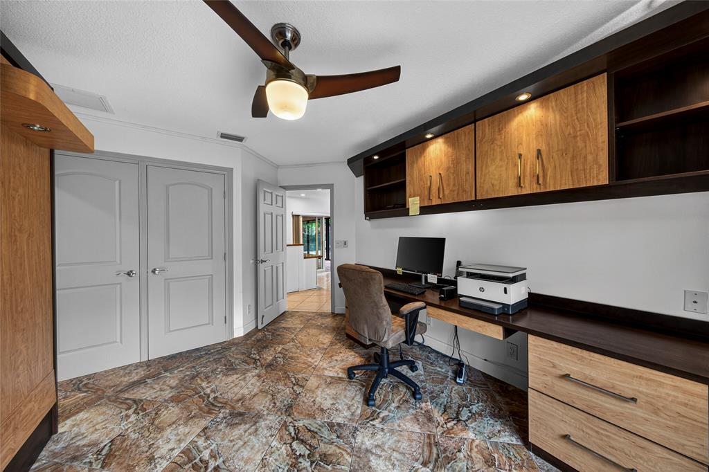 10405 Canoe Brook Circle Boca Raton, FL 33498 - Photo 35 of 56 a workspace with wooden floor and a window