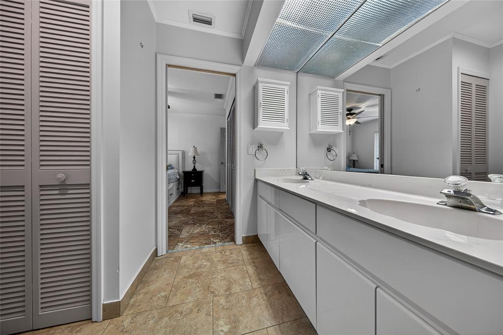 10405 Canoe Brook Circle Boca Raton, FL 33498 - Photo 40 of 56 a bathroom with a double vanity sink and a mirror