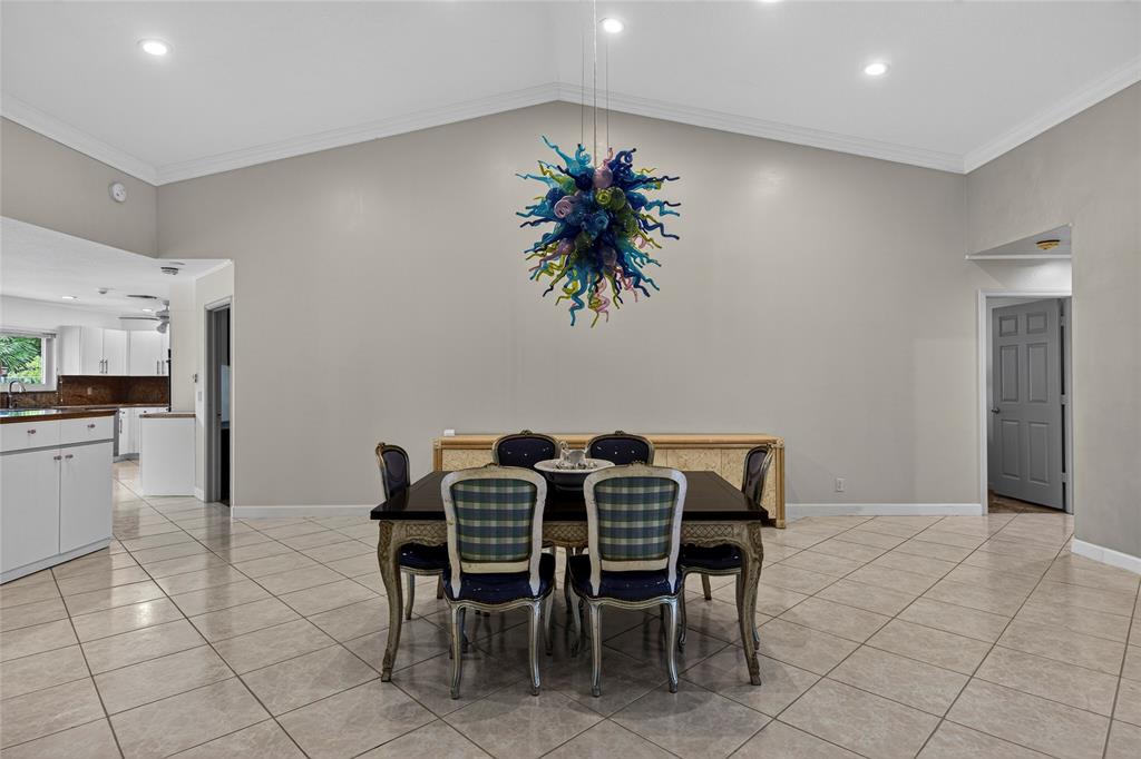 10405 Canoe Brook Circle Boca Raton, FL 33498 - Photo 10 of 56 a view of a dining room with furniture and chandelier