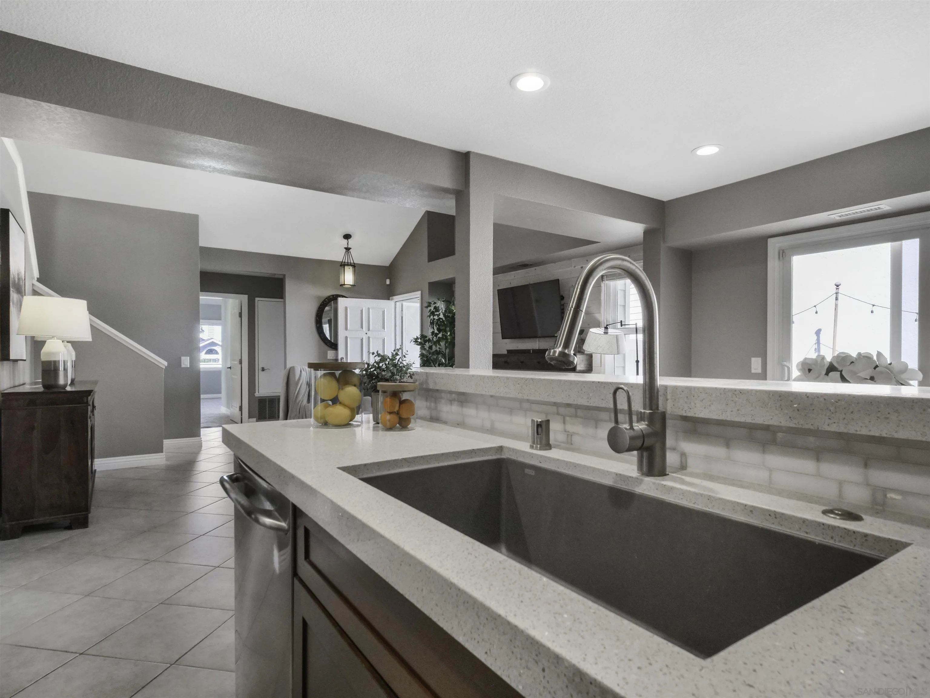 809 Sandbar Way Carlsbad, CA 92011 - Photo 12 of 39 a kitchen with a sink and a refrigerator