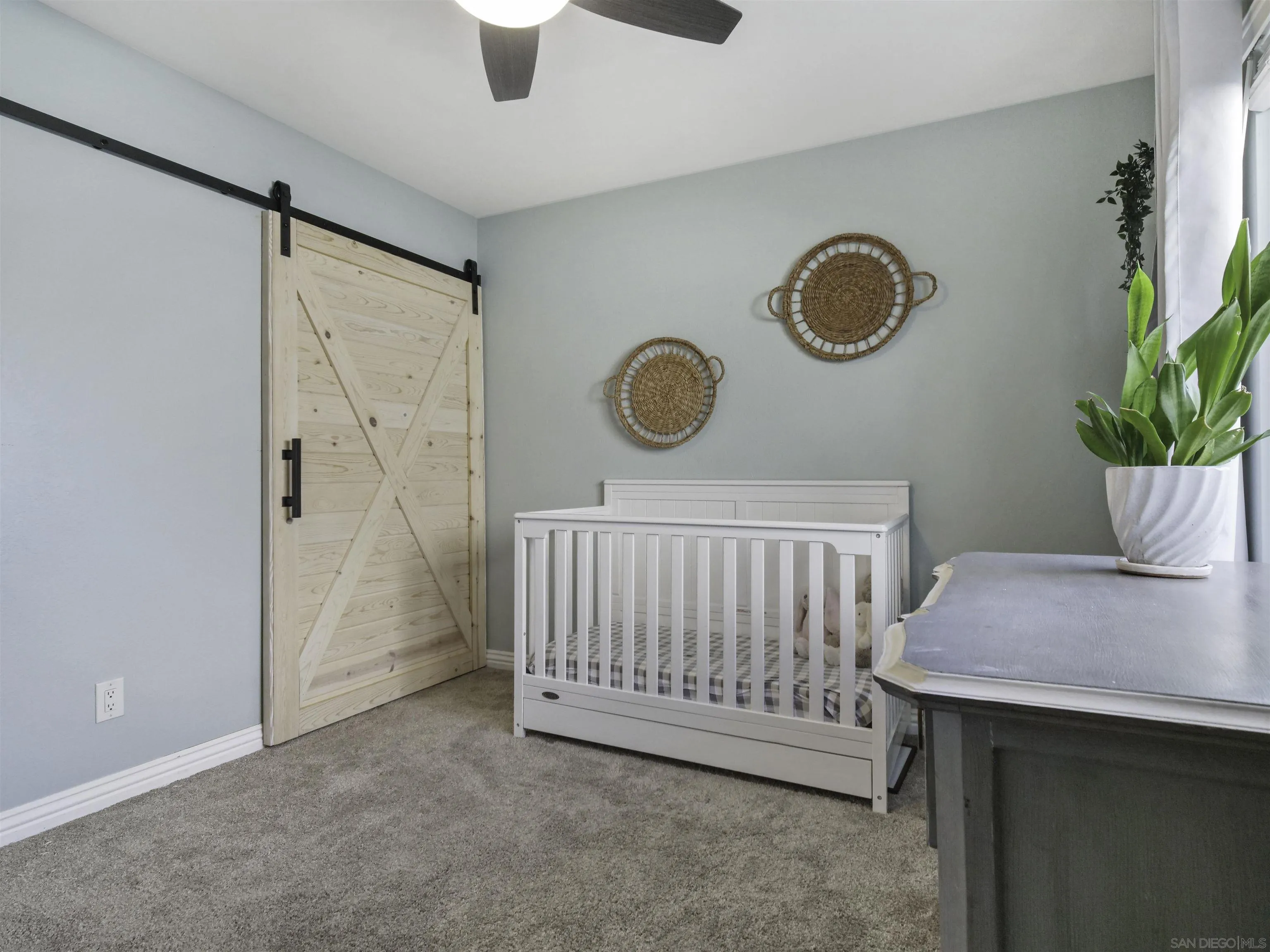 809 Sandbar Way Carlsbad, CA 92011 - Photo 23 of 39 a view of a hallway to a room with windows