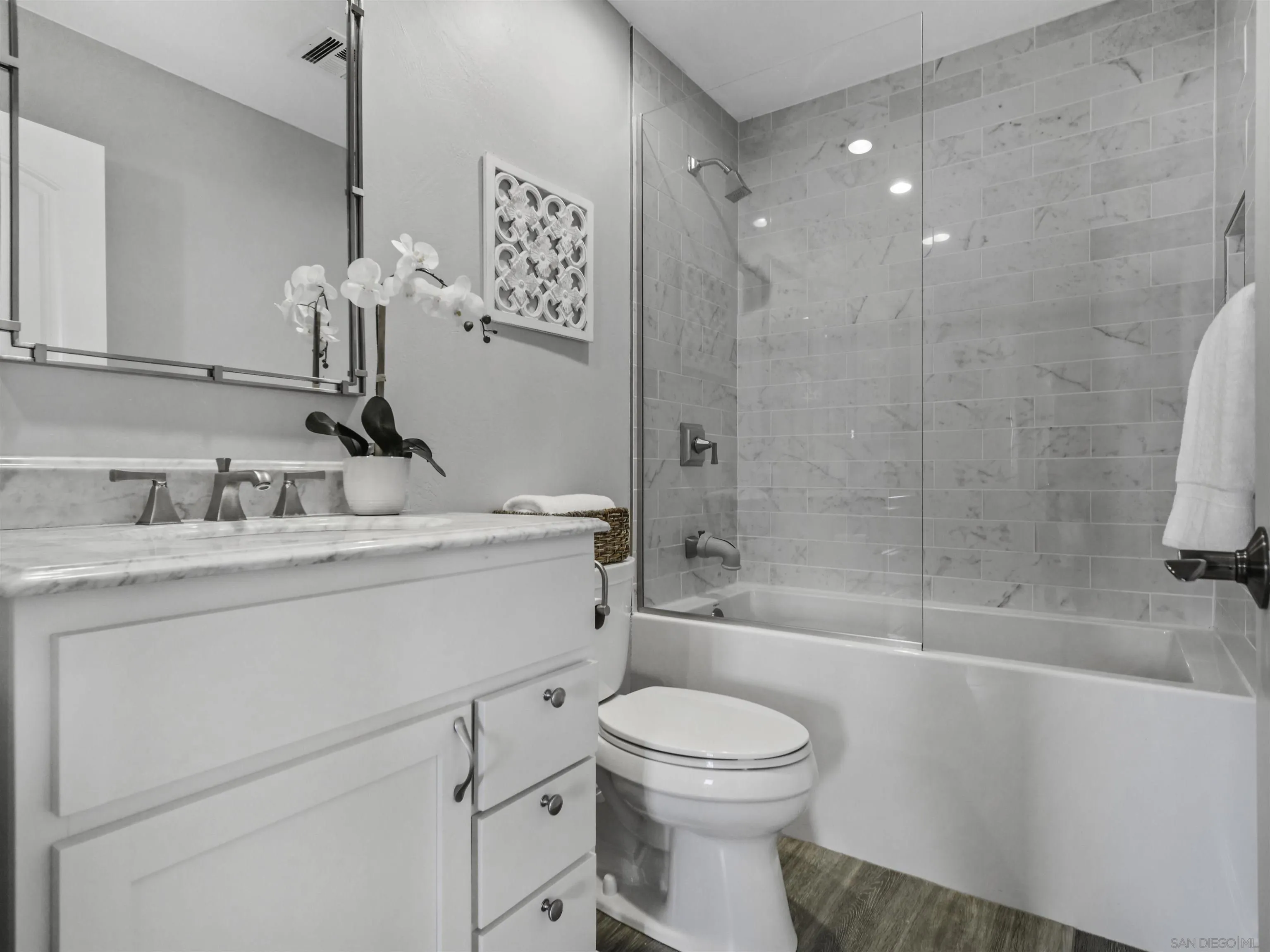 809 Sandbar Way Carlsbad, CA 92011 - Photo 26 of 39 a bathroom with a sink a toilet and shower