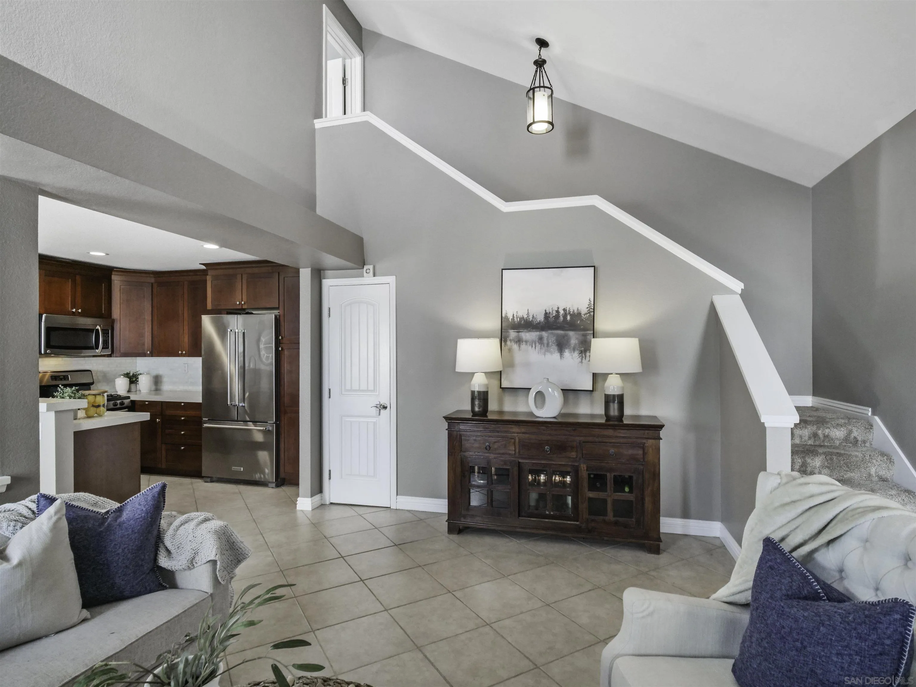 809 Sandbar Way Carlsbad, CA 92011 - Photo 27 of 39 a living room with furniture and kitchen view