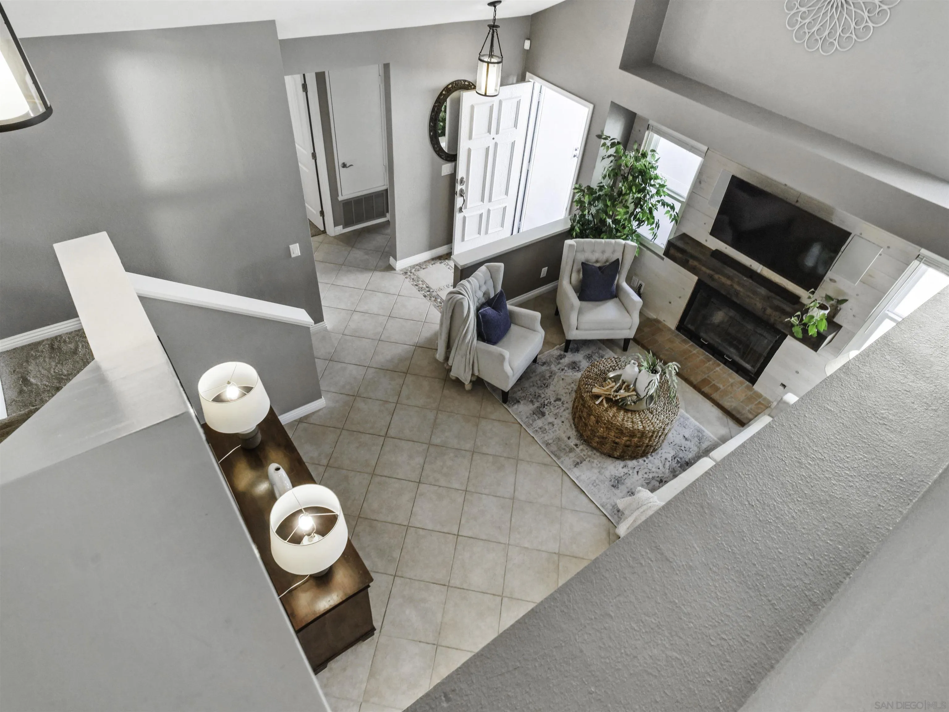 809 Sandbar Way Carlsbad, CA 92011 - Photo 28 of 39 a living room with furniture and a fireplace