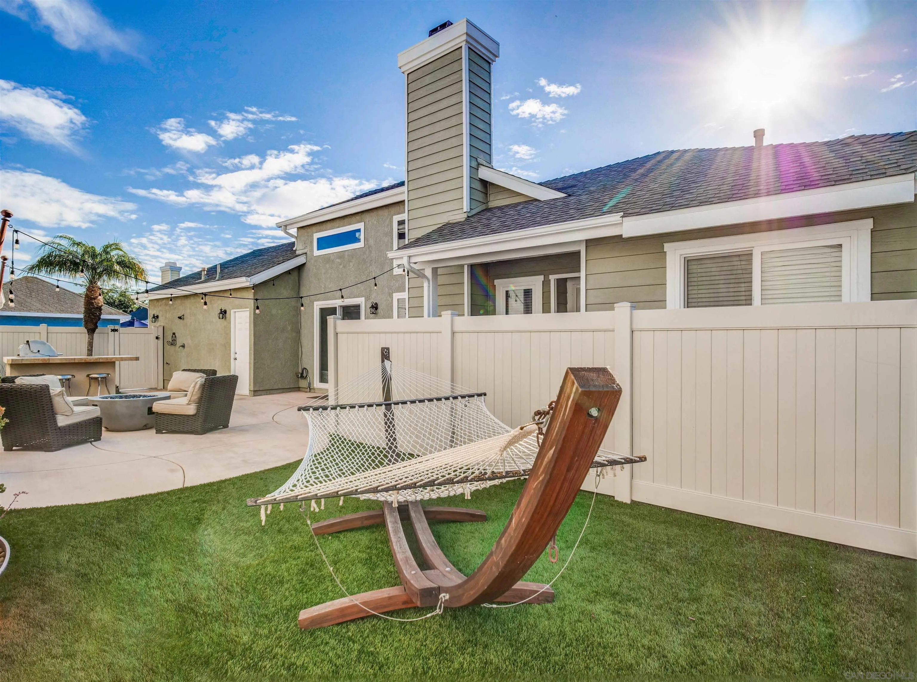 809 Sandbar Way Carlsbad, CA 92011 - Photo 32 of 39 a view of a house with a backyard porch and sitting area