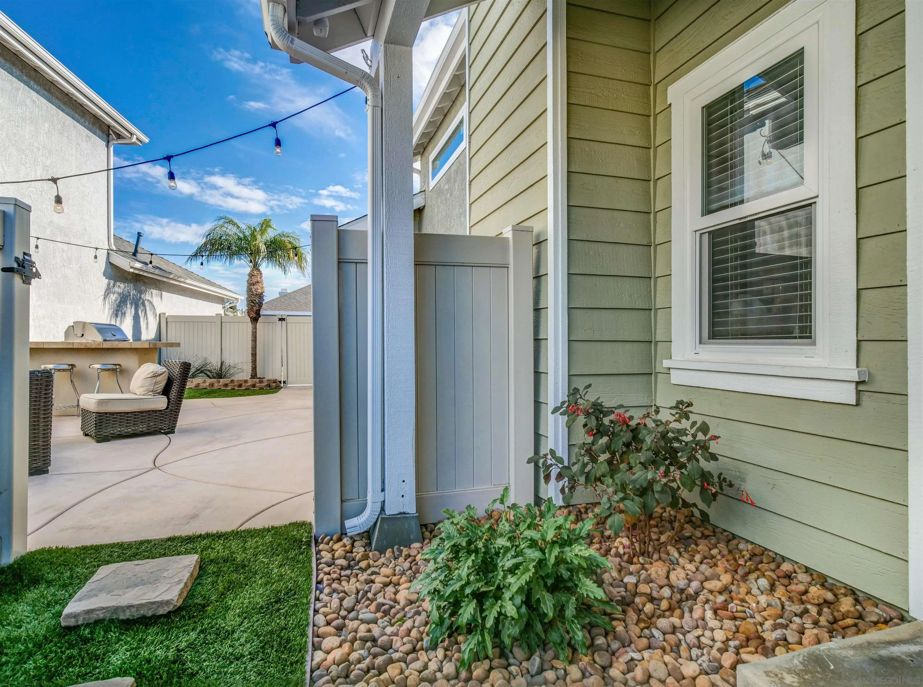 809 Sandbar Way Carlsbad, CA 92011 - Photo 36 of 39 a view of a brick house with a yard