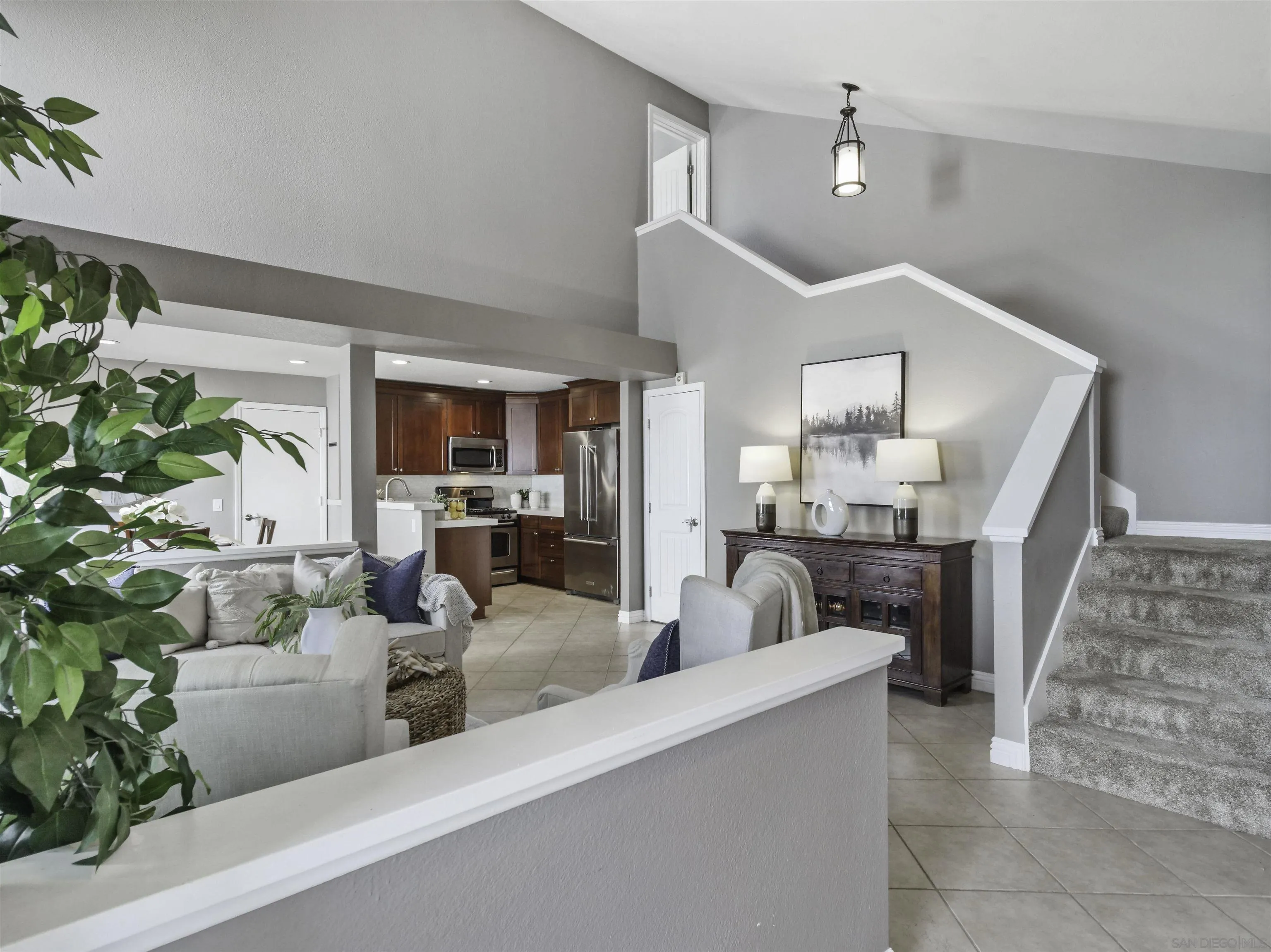 809 Sandbar Way Carlsbad, CA 92011 - Photo 6 of 39 a view of a living room and kitchen with furniture