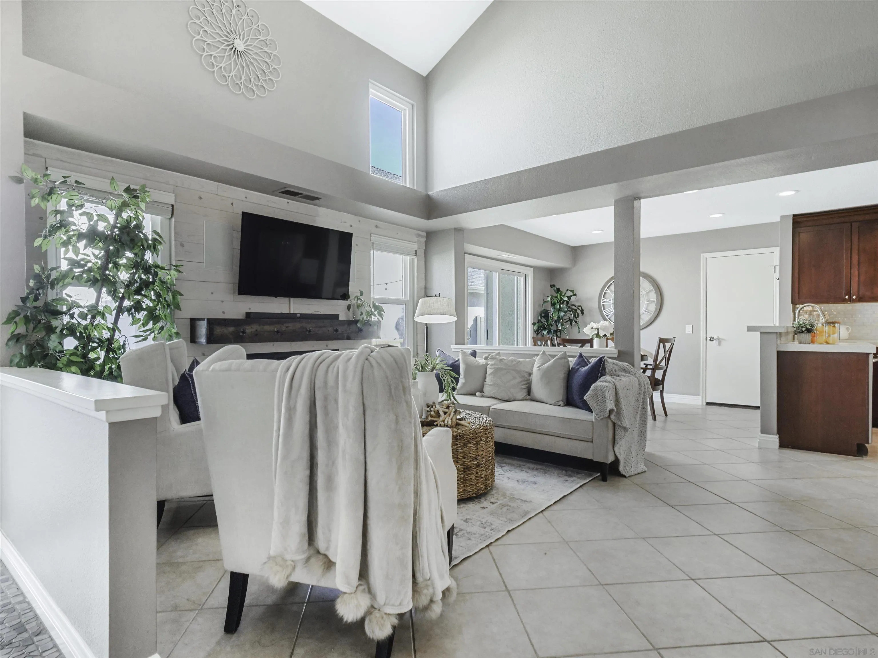 809 Sandbar Way Carlsbad, CA 92011 - Photo 8 of 39 a living room with furniture and a flat screen tv