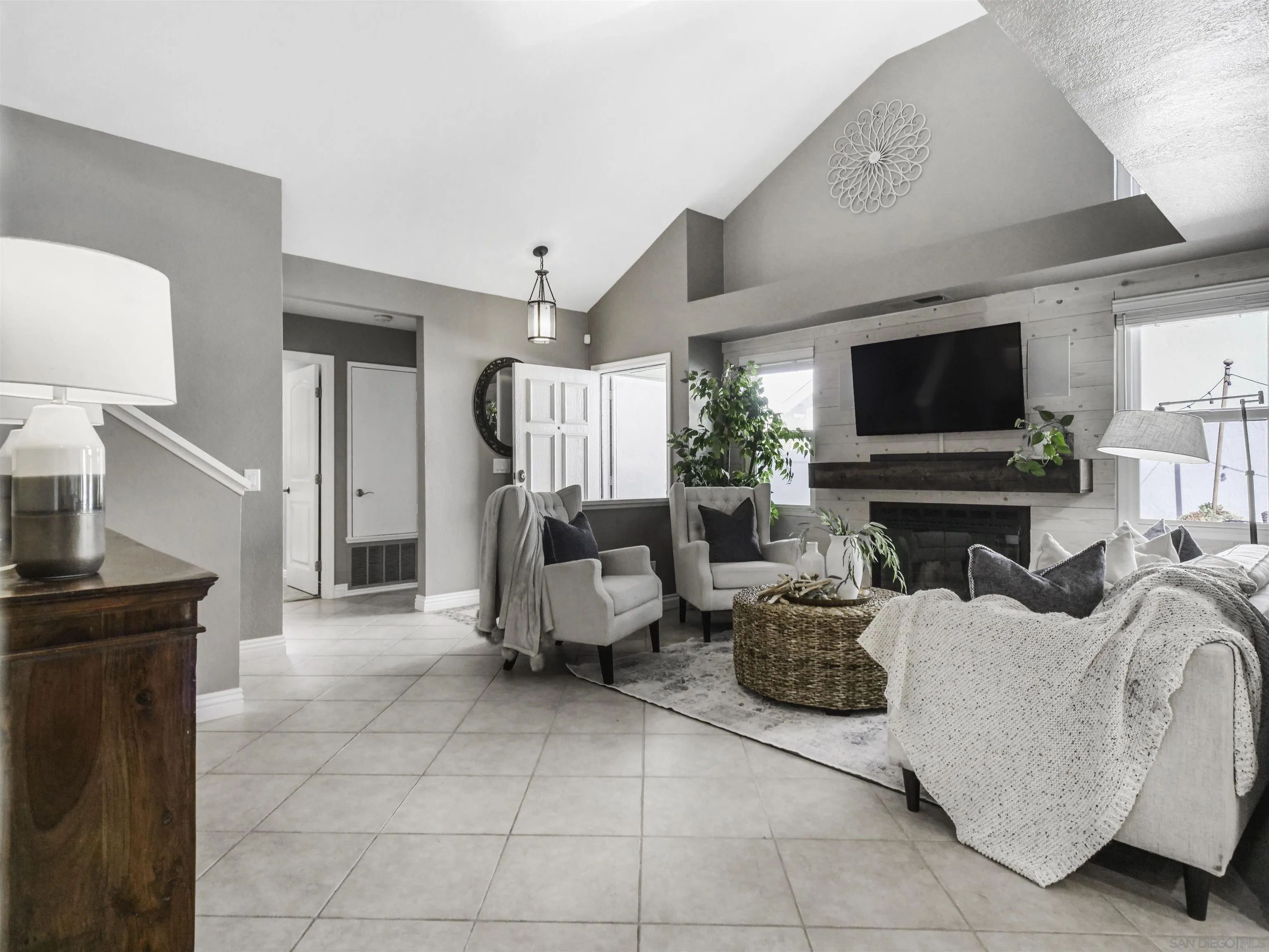809 Sandbar Way Carlsbad, CA 92011 - Photo 9 of 39 a living room with furniture and a flat screen tv