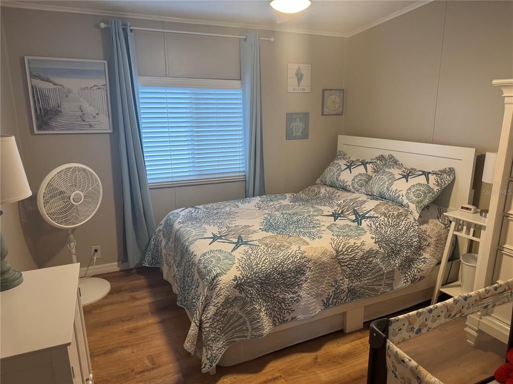 1001 Starkey Road, Unit 310 Largo, FL 33771 - Photo 14 of 25 a bedroom with a bed and a window