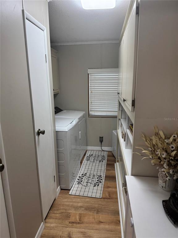 1001 Starkey Road, Unit 310 Largo, FL 33771 - Photo 16 of 25 a room with wooden floor and potted plant