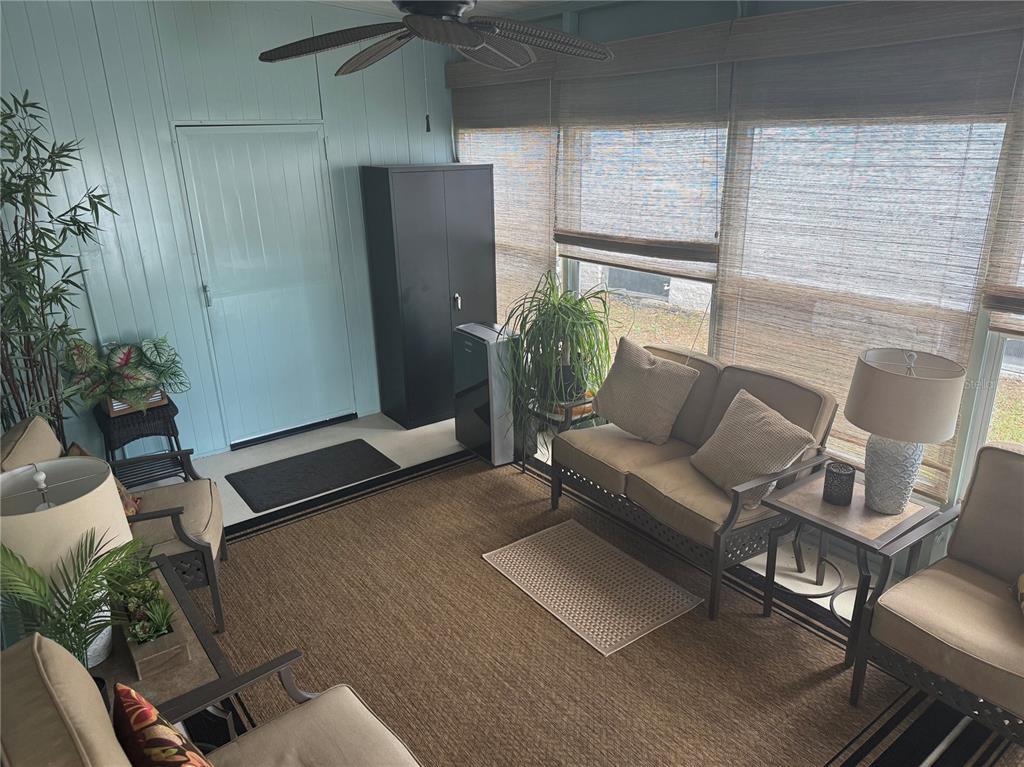 1001 Starkey Road, Unit 310 Largo, FL 33771 - Photo 17 of 25 a living room with furniture and a potted plant