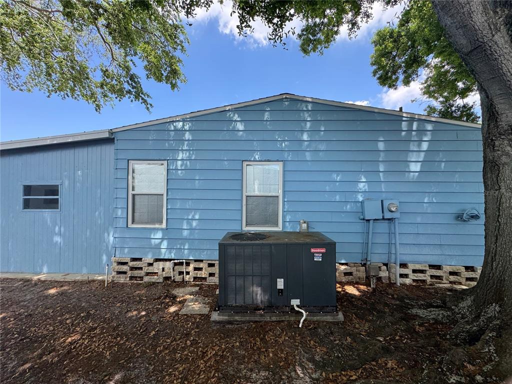 1001 Starkey Road, Unit 310 Largo, FL 33771 - Photo 24 of 25 a front view of a house with a yard