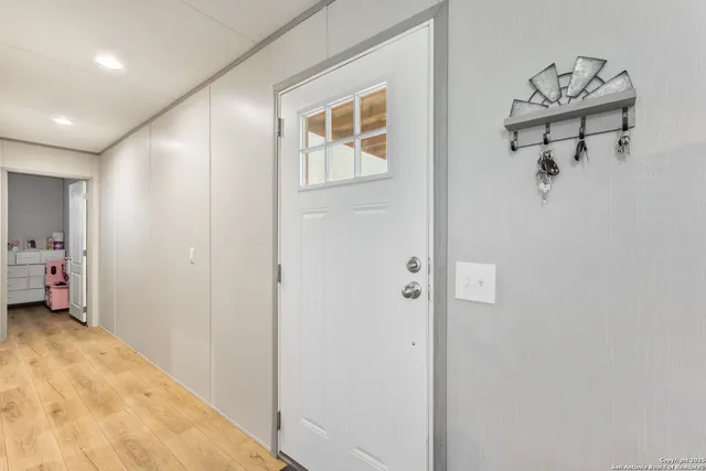 a view of a hallway with workspace