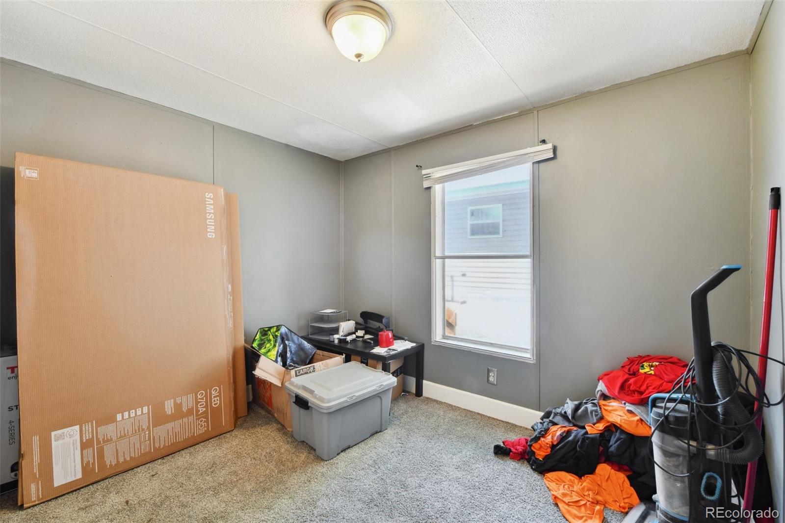 9400 North Elm Court Denver, CO 80260 - Photo 17 of 23 a living room with furniture and a window