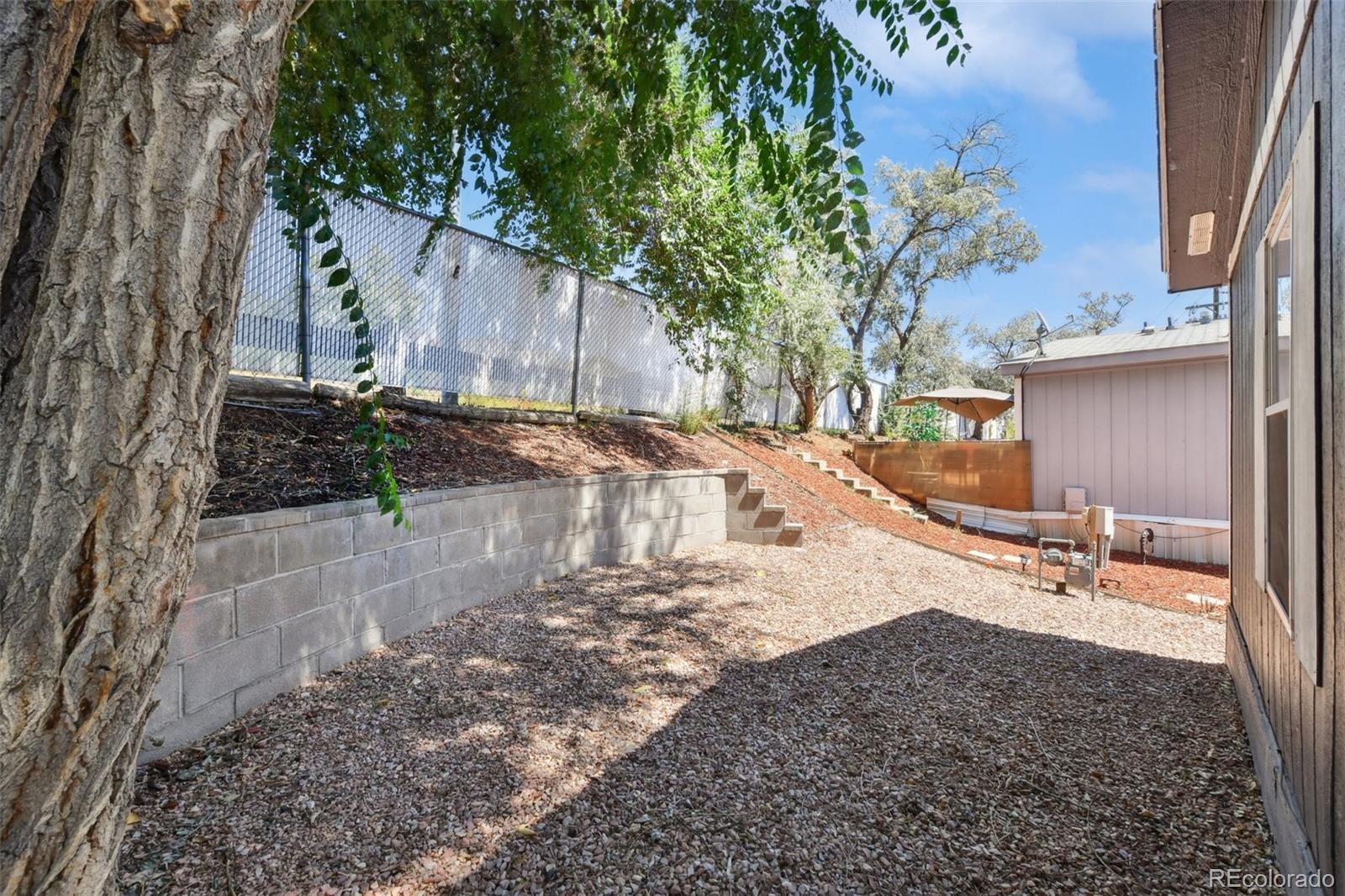 9400 North Elm Court Denver, CO 80260 - Photo 20 of 23 a view of a backyard of the house