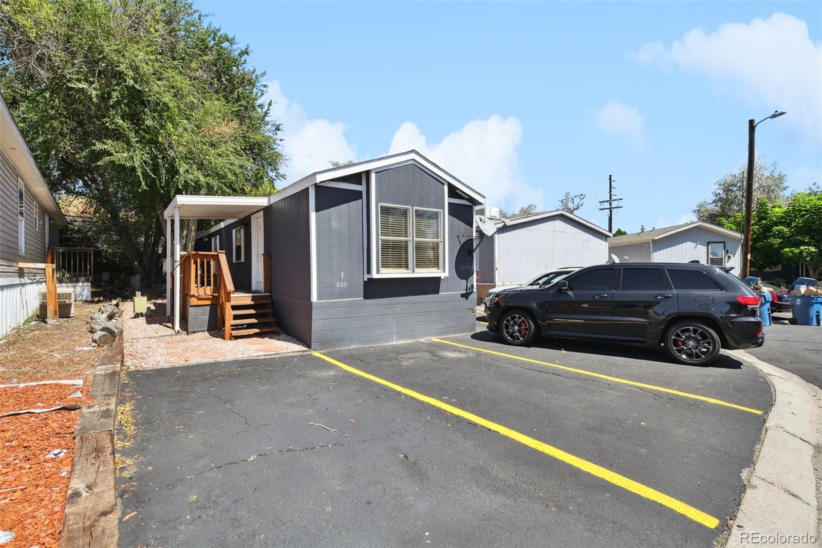 9400 North Elm Court Denver, CO 80260 - Photo 21 of 23 a view of a car parked in front of house