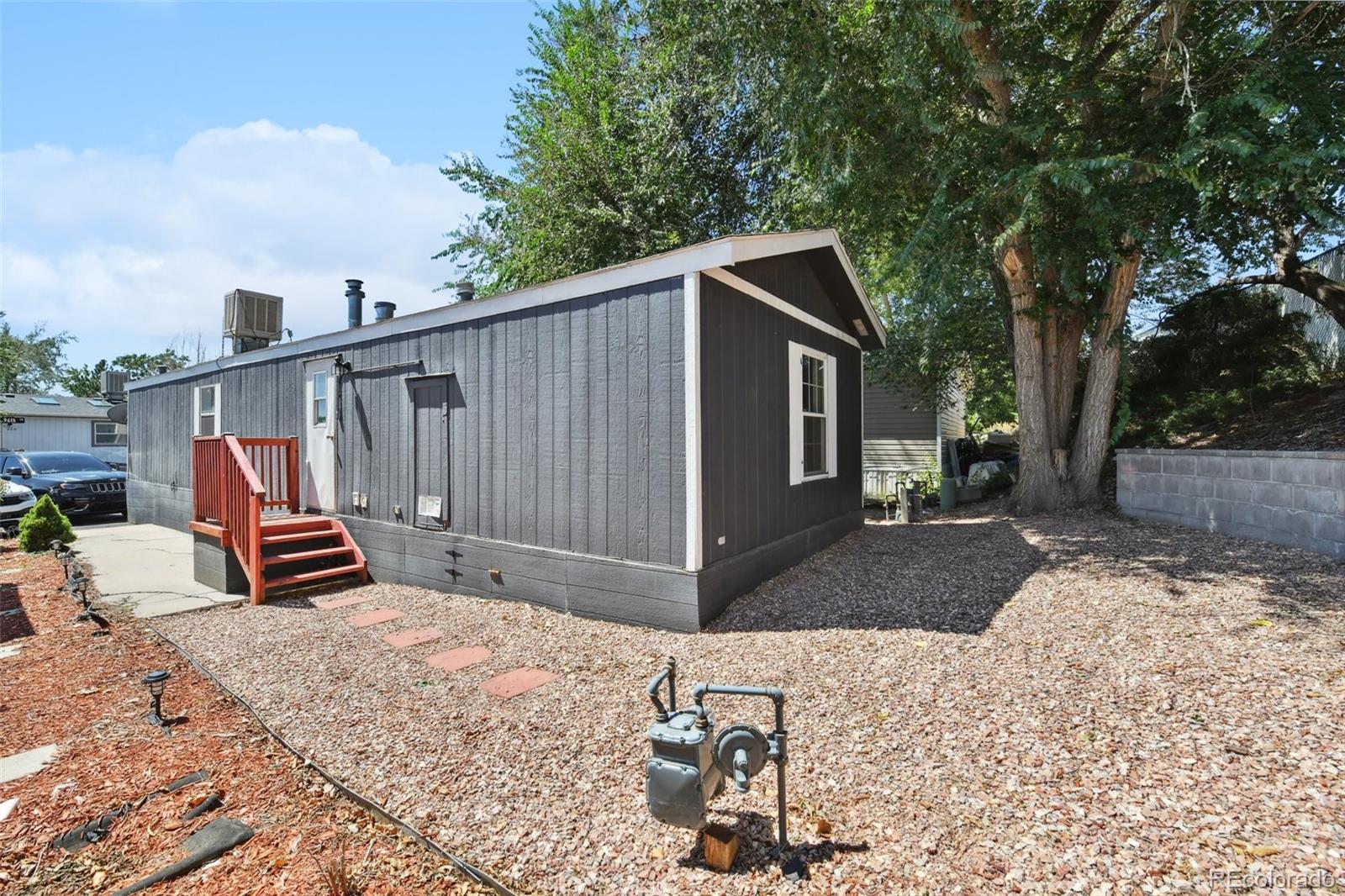 9400 North Elm Court Denver, CO 80260 - Photo 22 of 23 a view of a backyard with sitting area