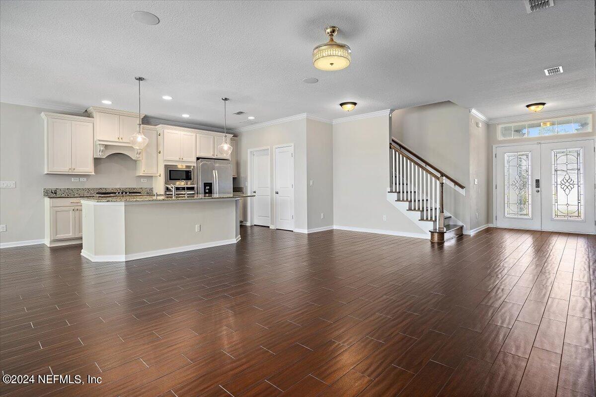 9802 Kevin Road Jacksonville, FL 32257 - Photo 12 of 23 a view of a kitchen with stove and wooden floor