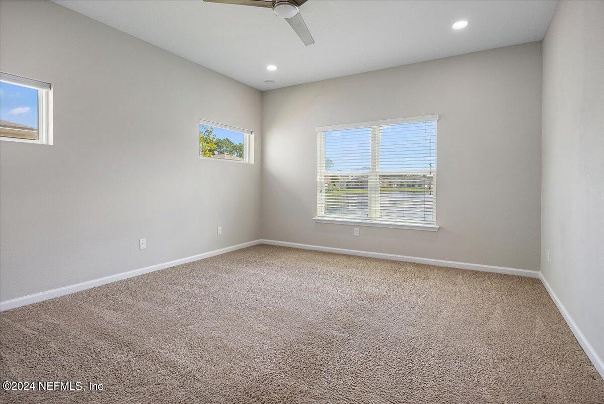 9802 Kevin Road Jacksonville, FL 32257 - Photo 13 of 23 an empty room with windows