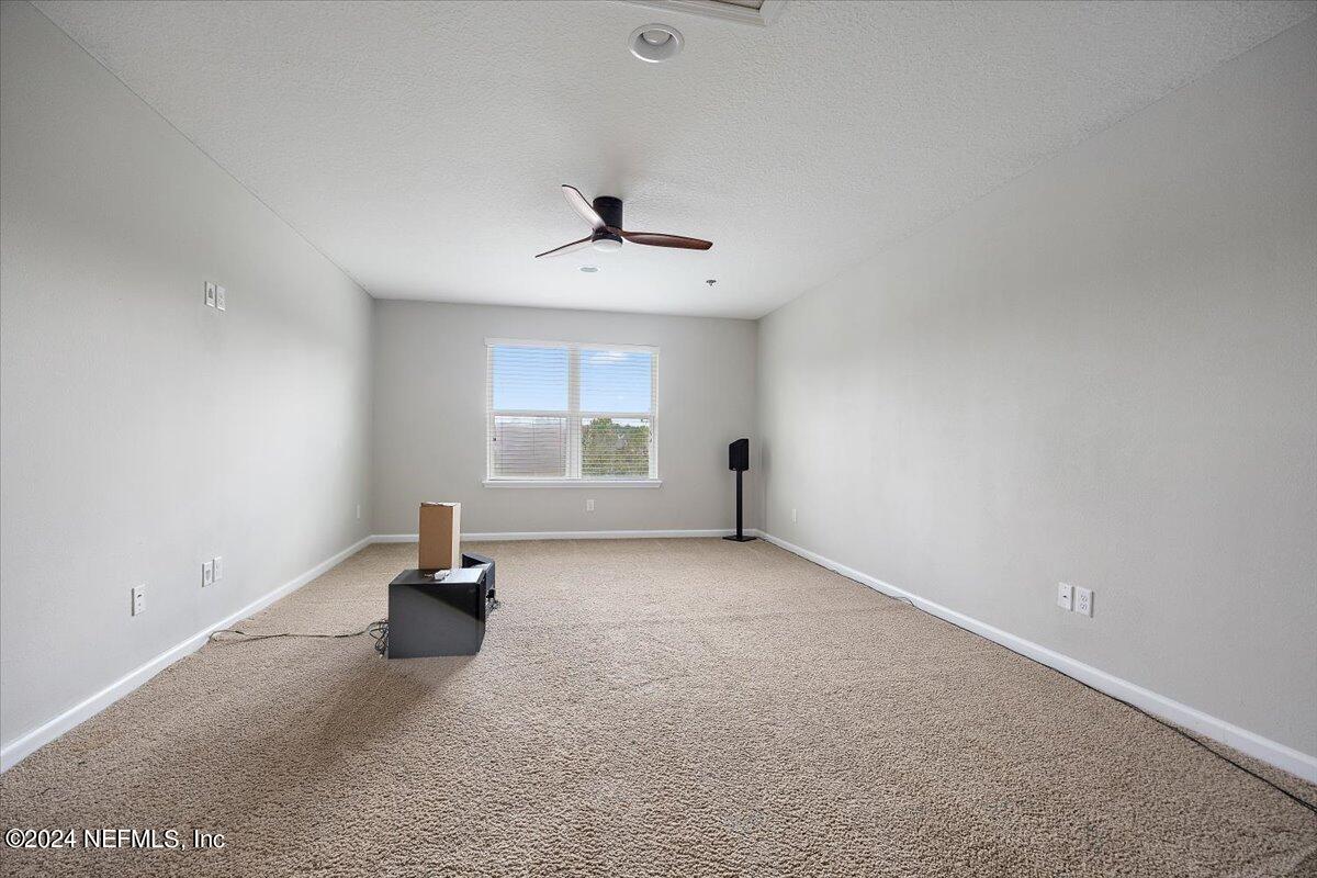 9802 Kevin Road Jacksonville, FL 32257 - Photo 18 of 23 wooden floor in an empty room with a window