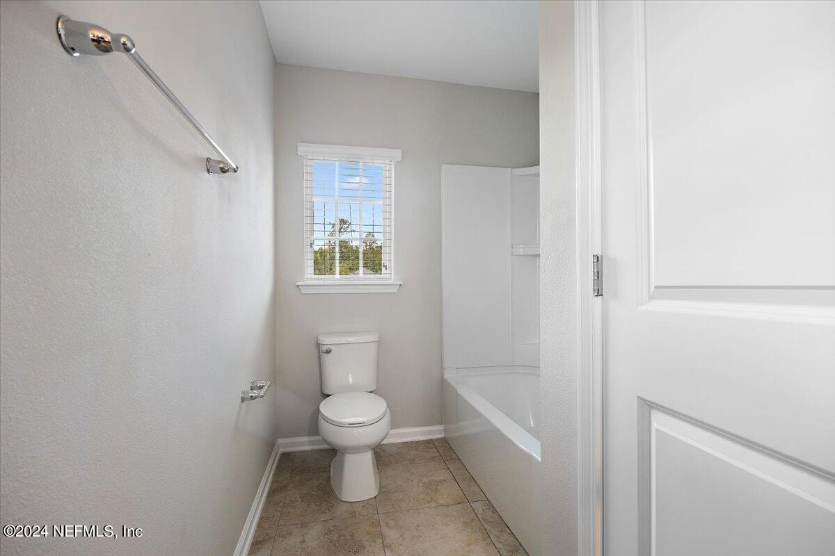 9802 Kevin Road Jacksonville, FL 32257 - Photo 20 of 23 a bathroom with a toilet