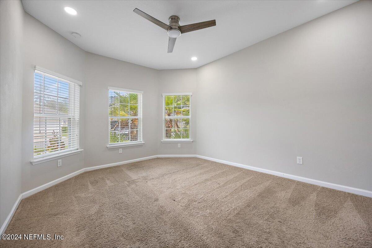 9802 Kevin Road Jacksonville, FL 32257 - Photo 4 of 23 a view of an empty room with a window
