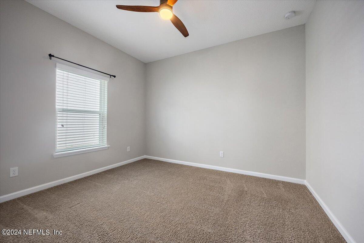 9802 Kevin Road Jacksonville, FL 32257 - Photo 5 of 23 an empty room with a window