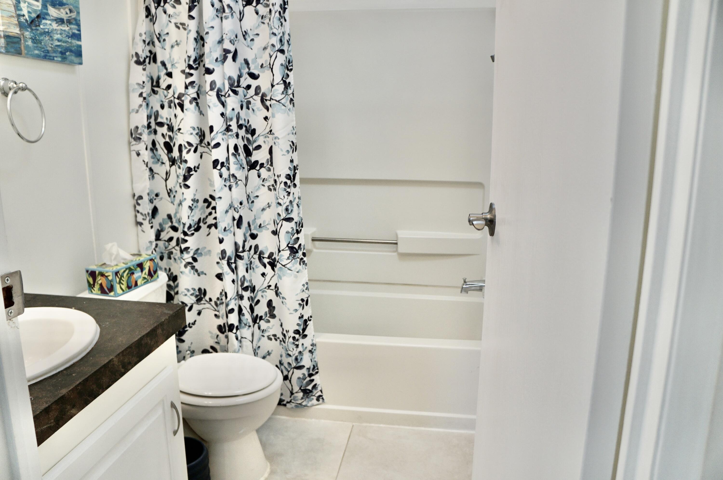 325 Mockingbird Avenue Fort Pierce, FL 34982 - Photo 20 of 39 a bathroom with a toilet and a sink