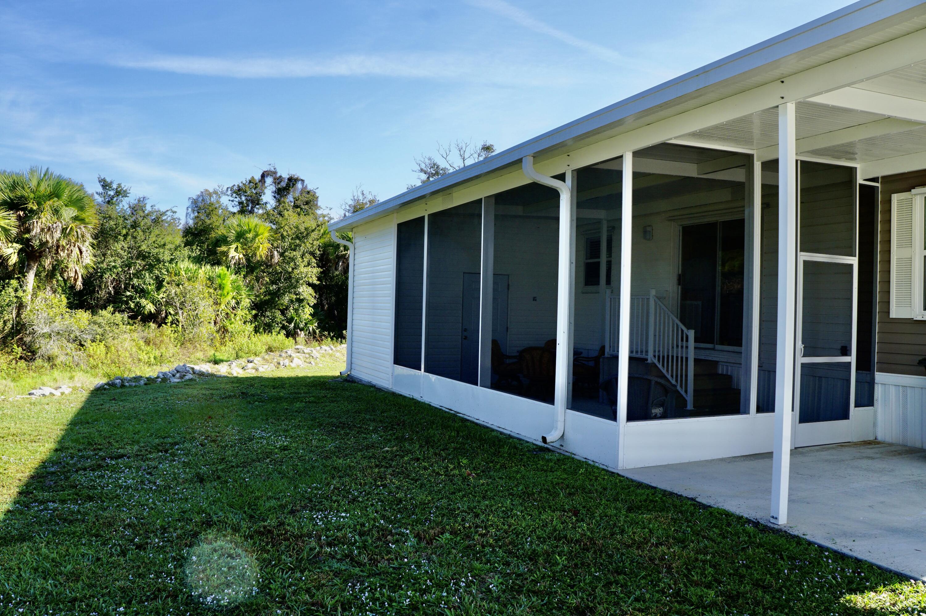 325 Mockingbird Avenue Fort Pierce, FL 34982 - Photo 3 of 39 a view of a porch with a backyard