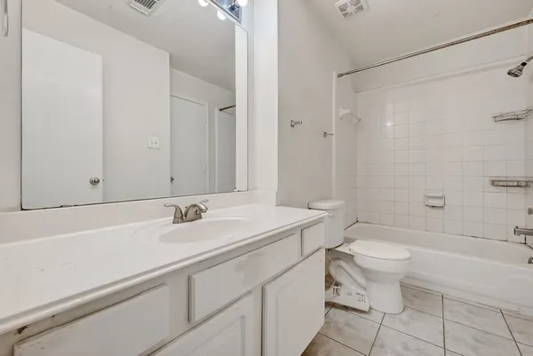 a bathroom with a sink a toilet and a bathtub