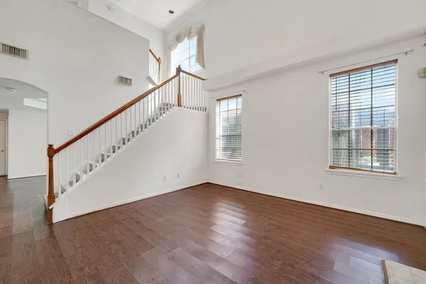 a view of an entryway with wooden floor