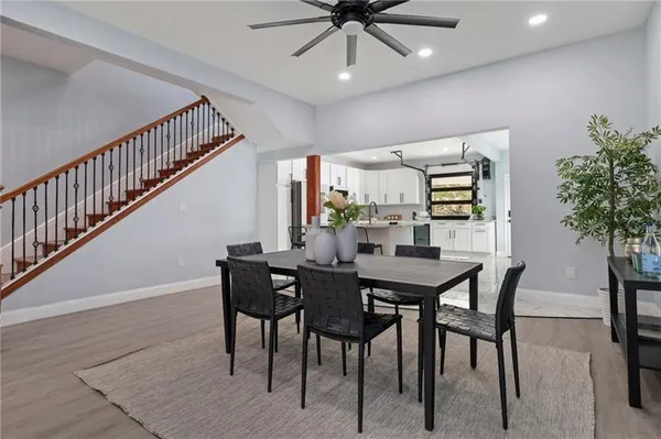 a view of a dining room with furniture and wooden floor