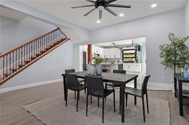 a view of a dining room with furniture and wooden floor