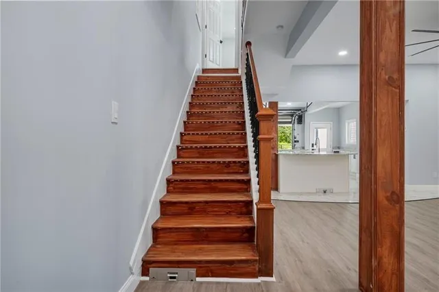 a view of entryway and hall with wooden floor