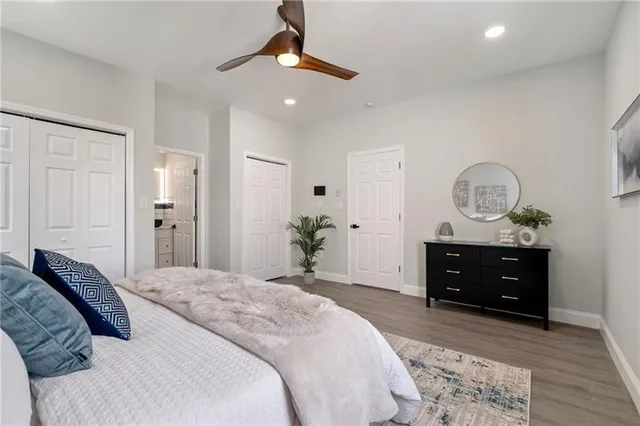 a bedroom with a bed and a dresser