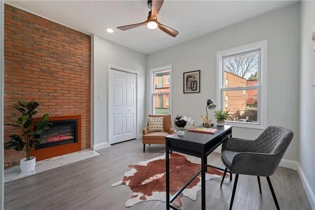 a living room with furniture and a fireplace
