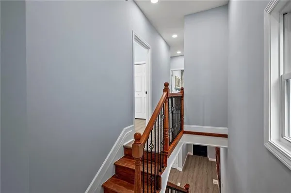 a view of entryway with wooden floor and stairs