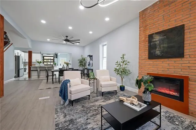 a living room with furniture and a fireplace