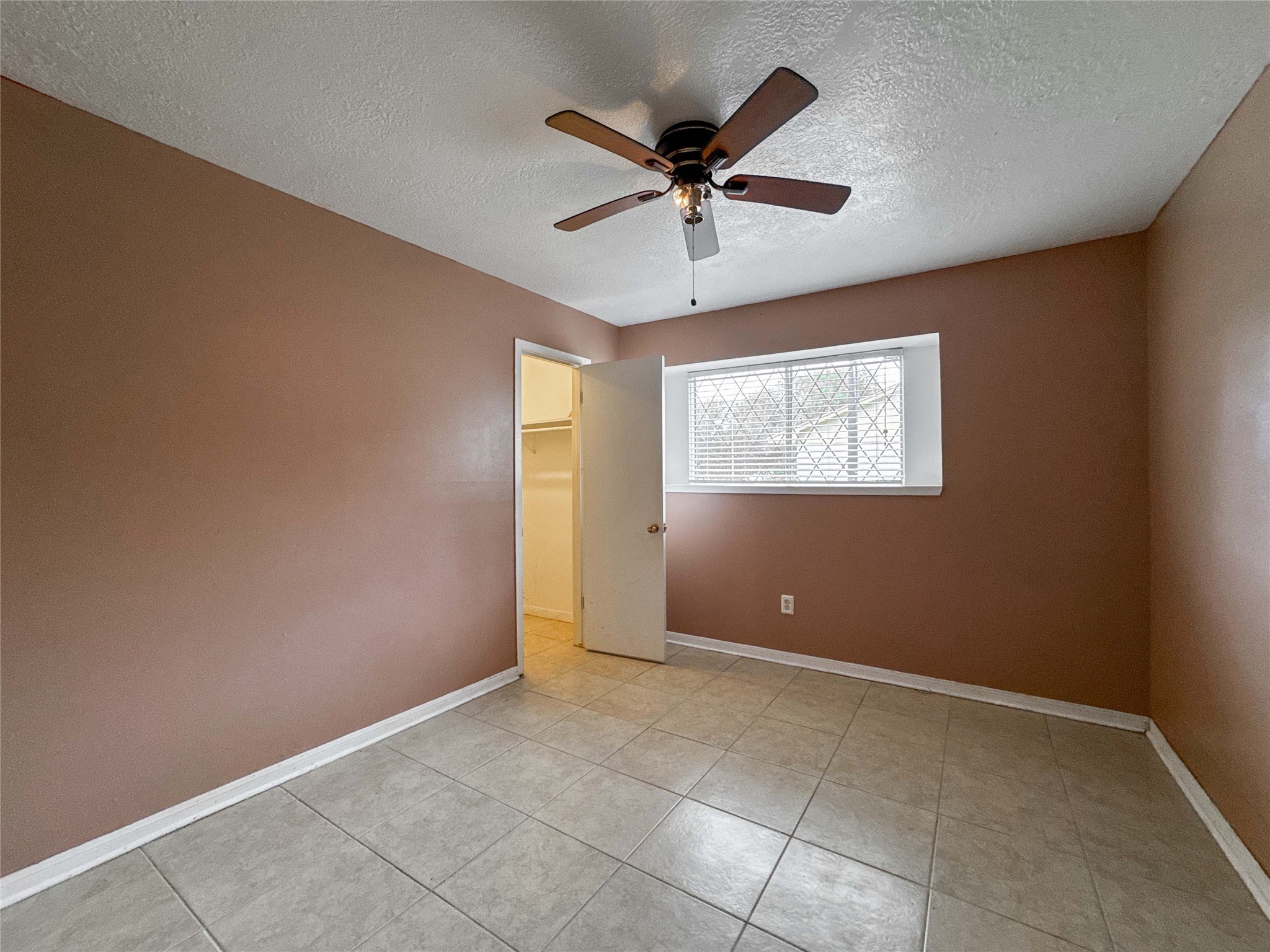4522 Sage Circle Baytown, TX 77521 - Photo 21 of 33 a view of an empty room with a window