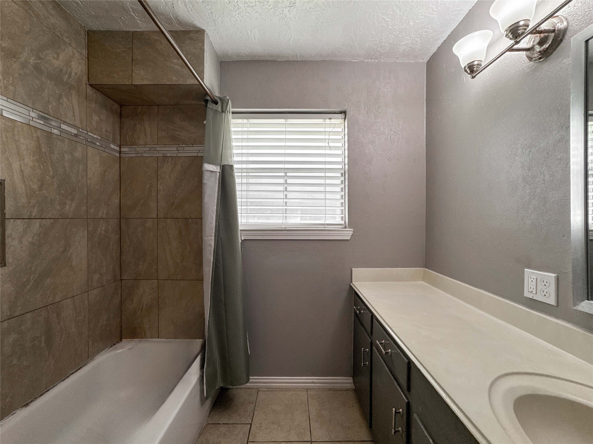 4522 Sage Circle Baytown, TX 77521 - Photo 24 of 33 a bathroom with a granite countertop sink toilet and shower