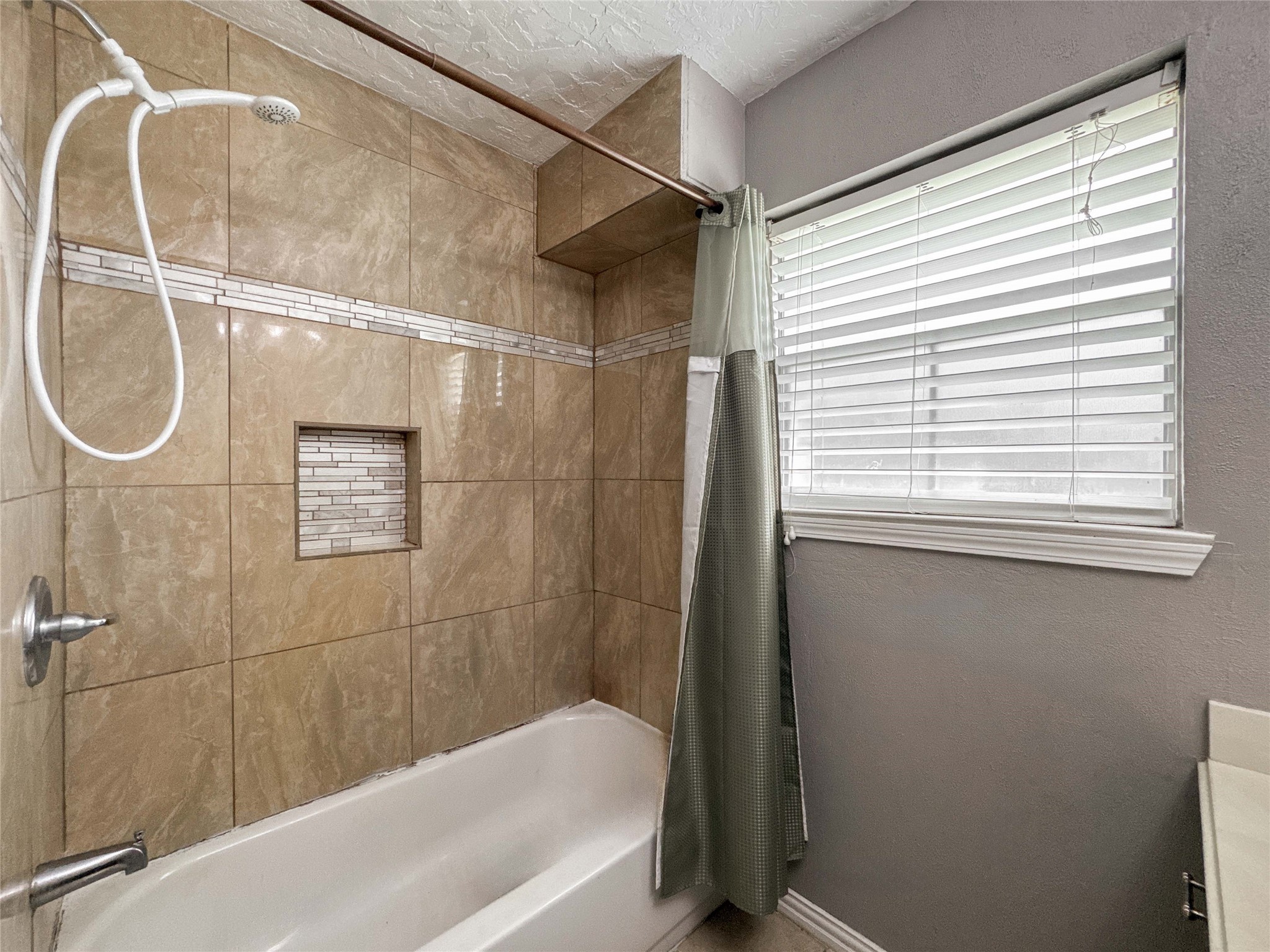 4522 Sage Circle Baytown, TX 77521 - Photo 25 of 33 a bathroom with a bath tub with a shower