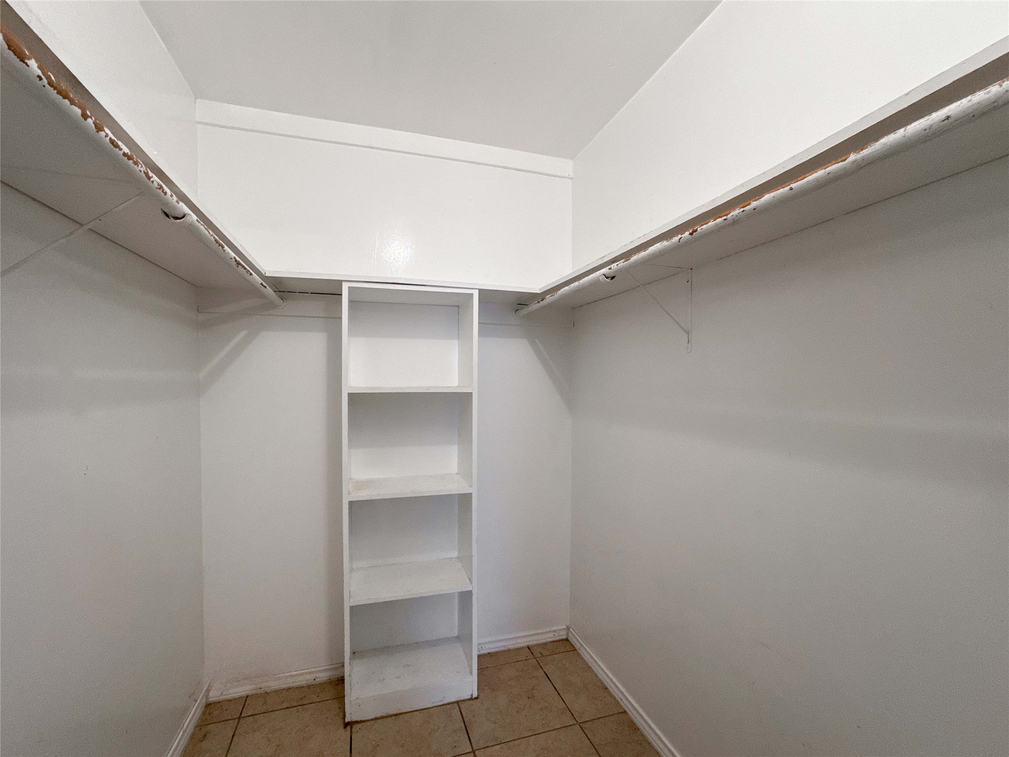 4522 Sage Circle Baytown, TX 77521 - Photo 26 of 33 a view of an empty walk in closet