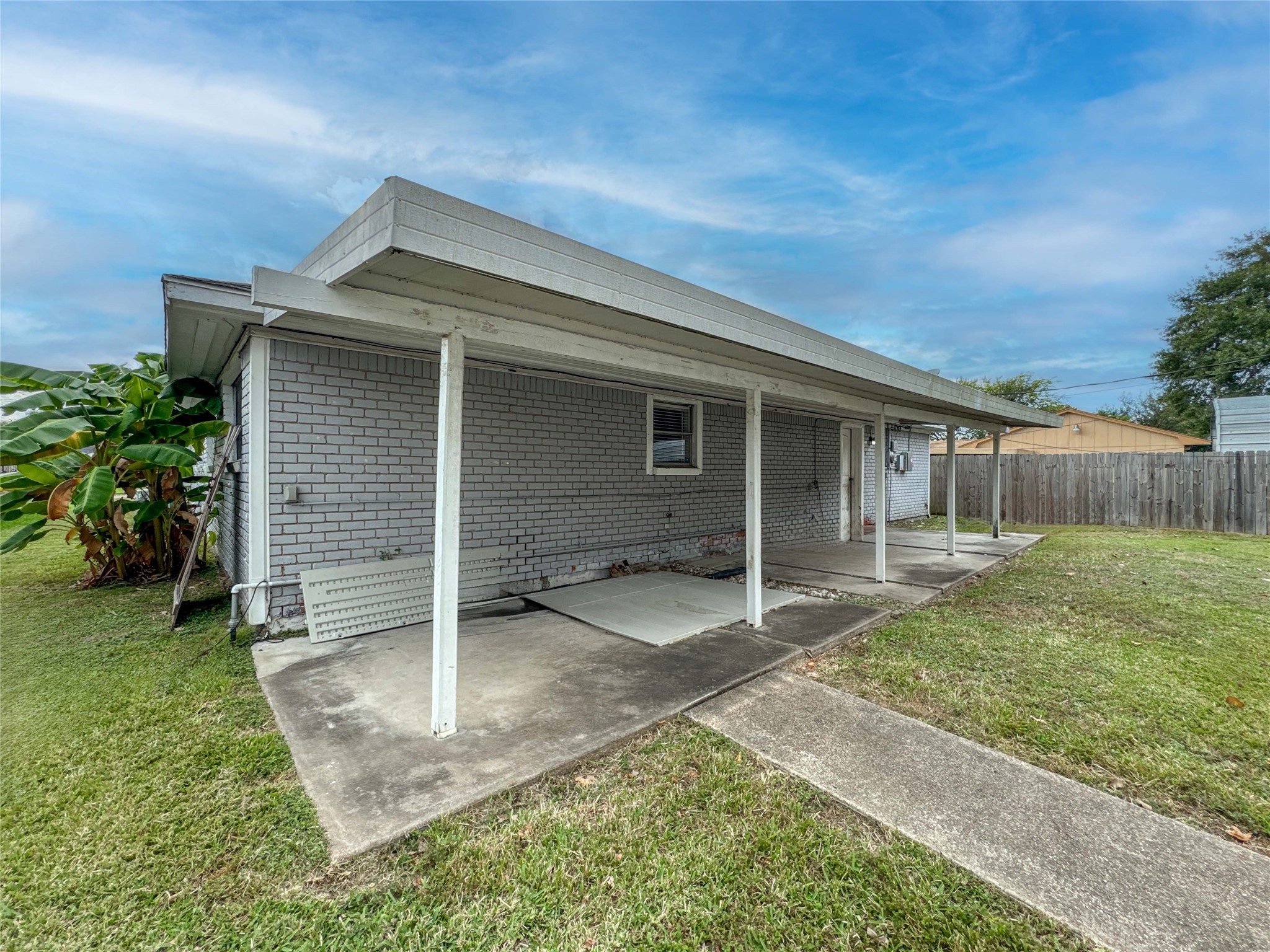 4522 Sage Circle Baytown, TX 77521 - Photo 33 of 33 a backyard of a house with barbeque oven and outdoor seating