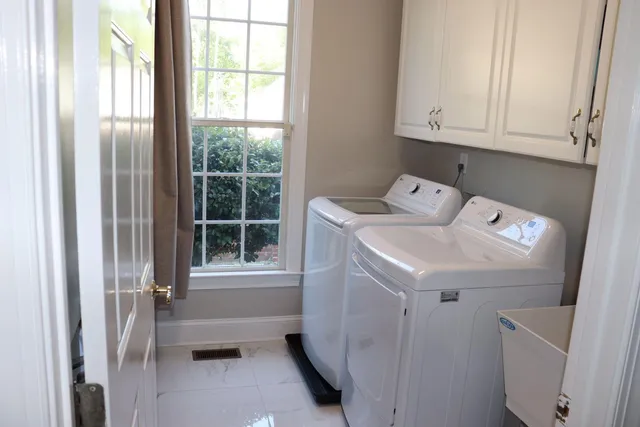 a utility room with dryer and washer